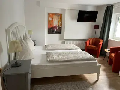 Ein Bett oder Betten in einem Zimmer der Unterkunft Ferienwohung Auszeit am Eifelsteig