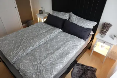Ein Bett oder Betten in einem Zimmer der Unterkunft Ver-Reiss-t
