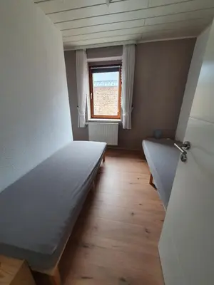 Ein Bett oder Betten in einem Zimmer der Unterkunft Ferienwohnung Hofmann