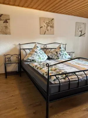 Ein Bett oder Betten in einem Zimmer der Unterkunft Ferienhaus Eifelperle