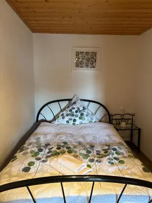 Ein Bett oder Betten in einem Zimmer der Unterkunft Ferienhaus Eifelperle