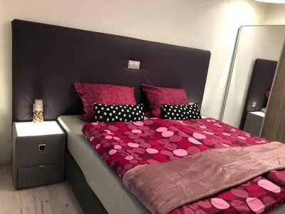 Ein Bett oder Betten in einem Zimmer der Unterkunft Am Weinberg