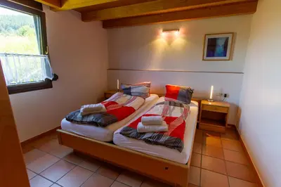 Ein Bett oder Betten in einem Zimmer der Unterkunft Weingut & Gästehaus Heidhof