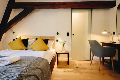 Ein Bett oder Betten in einem Zimmer der Unterkunft Boutiquehotel Kloster Pfalzel