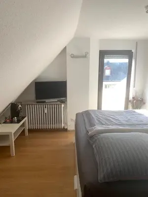 Ein Bett oder Betten in einem Zimmer der Unterkunft Ferien Apartment Trier Süd