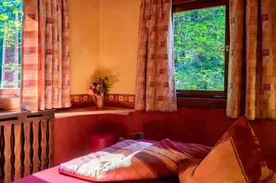 Ein Bett oder Betten in einem Zimmer der Unterkunft Hotel Schmausemühle
