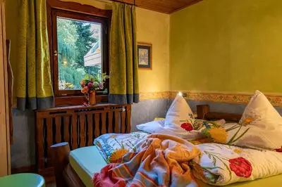 Ein Bett oder Betten in einem Zimmer der Unterkunft Hotel Schmausemühle