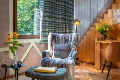 Ein Sitzbereich in der Unterkunft Hotel Schmausemühle