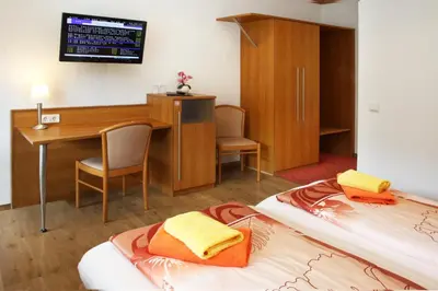 Ein Bett oder Betten in einem Zimmer der Unterkunft Hotel Rheinkönig