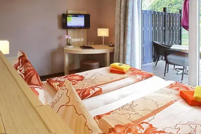 Ein Bett oder Betten in einem Zimmer der Unterkunft Hotel Rheinkönig