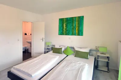 Ein Bett oder Betten in einem Zimmer der Unterkunft Ricks City Hotel