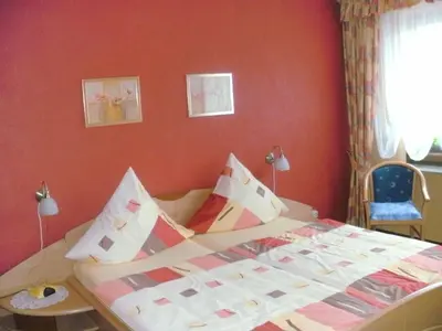Ein Bett oder Betten in einem Zimmer der Unterkunft Gästehaus Ruth Andrae