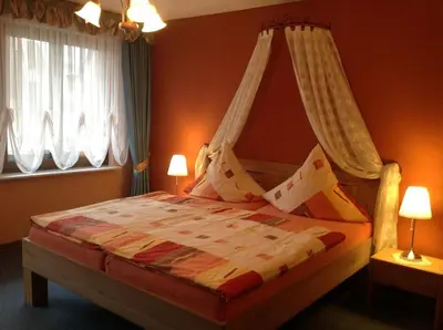 Ein Bett oder Betten in einem Zimmer der Unterkunft Gästehaus Ruth Andrae