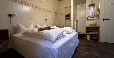 Ein Bett oder Betten in einem Zimmer der Unterkunft Villa zur Erholung Bed & Breakfast