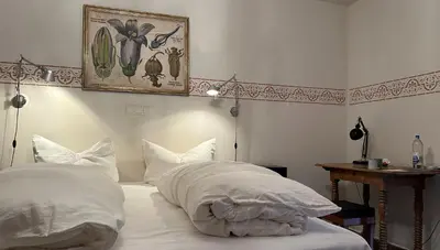 Ein Bett oder Betten in einem Zimmer der Unterkunft Villa zur Erholung Bed & Breakfast