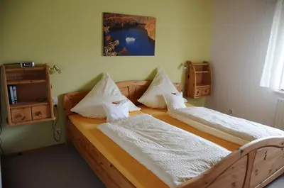 Ein Bett oder Betten in einem Zimmer der Unterkunft Nationalpark-Gastgeber Eifel