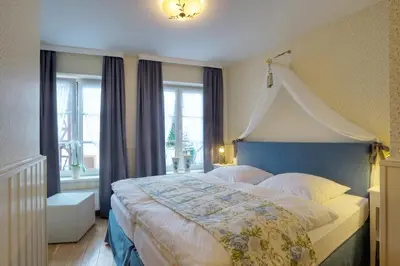 Ein Bett oder Betten in einem Zimmer der Unterkunft Märchenhotel