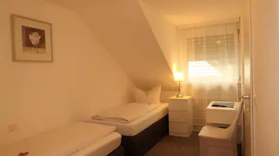 Ein Bett oder Betten in einem Zimmer der Unterkunft Hotel Zur Kripp
