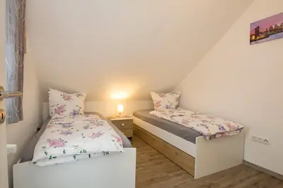 Ein Bett oder Betten in einem Zimmer der Unterkunft Ferienhaus an der Burg Namedy