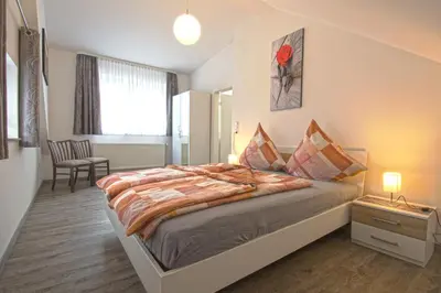 Ein Bett oder Betten in einem Zimmer der Unterkunft Ferienhaus an der Burg Namedy