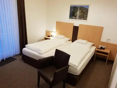 Ein Bett oder Betten in einem Zimmer der Unterkunft Hotel zum Anker