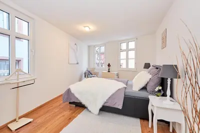 Ein Bett oder Betten in einem Zimmer der Unterkunft Schwanenhaus