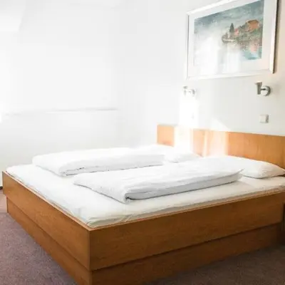 Ein Bett oder Betten in einem Zimmer der Unterkunft Hotel Imota