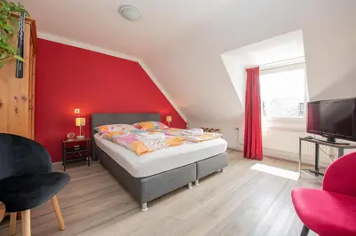 Ein Bett oder Betten in einem Zimmer der Unterkunft Gästehaus Mona Lisa