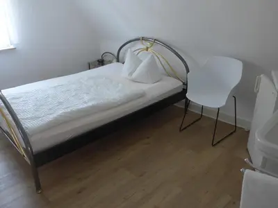 Ein Bett oder Betten in einem Zimmer der Unterkunft Pension Schneider