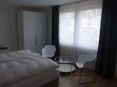 Ein Bett oder Betten in einem Zimmer der Unterkunft Pension Schneider