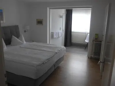 Ein Bett oder Betten in einem Zimmer der Unterkunft Pension Schneider