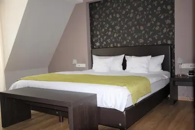 Ein Bett oder Betten in einem Zimmer der Unterkunft Feriendomizil am Lindenplatz