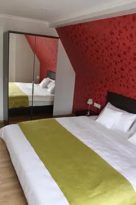 Ein Bett oder Betten in einem Zimmer der Unterkunft Feriendomizil am Lindenplatz