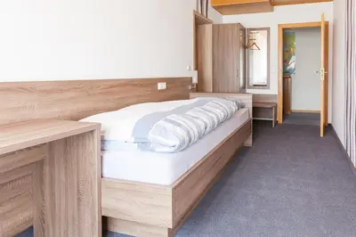 Ein Bett oder Betten in einem Zimmer der Unterkunft Gasthaus am Brunnen