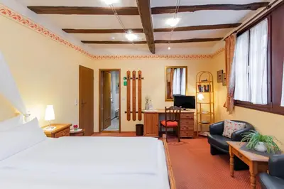 Ein Bett oder Betten in einem Zimmer der Unterkunft Hotel Weiler