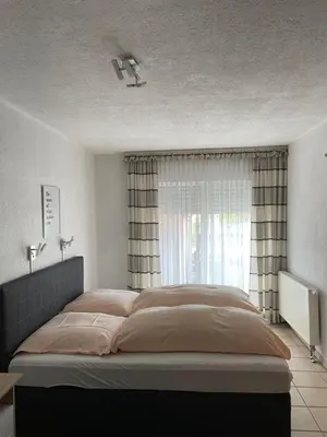 Ein Bett oder Betten in einem Zimmer der Unterkunft Hotel Restaurant Germania