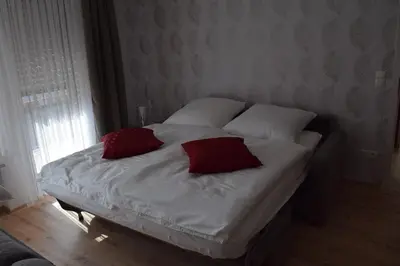Ein Bett oder Betten in einem Zimmer der Unterkunft Gästehaus Sylvia