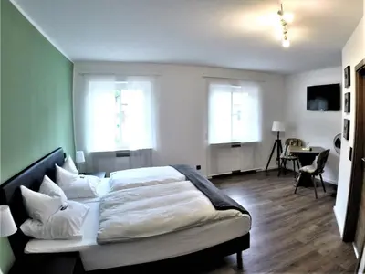 Ein Bett oder Betten in einem Zimmer der Unterkunft Landgasthof Ralinger Hof