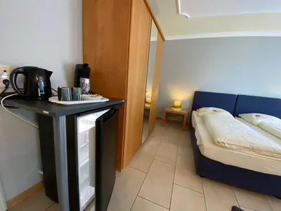 Ein Bett oder Betten in einem Zimmer der Unterkunft Gaestehaus Savo