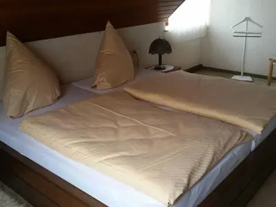 Ein Bett oder Betten in einem Zimmer der Unterkunft Ferienhaus Raabe