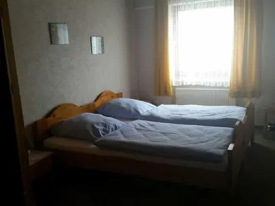 Ein Bett oder Betten in einem Zimmer der Unterkunft Ferienhaus Raabe