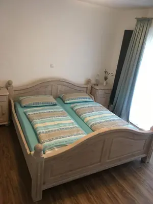 Ein Bett oder Betten in einem Zimmer der Unterkunft Sunnesching