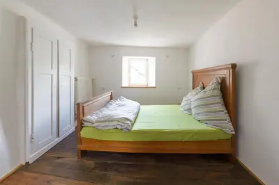 Ein Bett oder Betten in einem Zimmer der Unterkunft Nengshof Ferienhaus Gänseblümchen