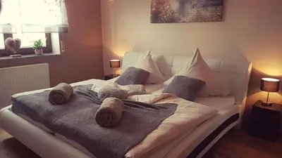 Ein Bett oder Betten in einem Zimmer der Unterkunft Eifel Dream Ferienwohnung Zingsheld