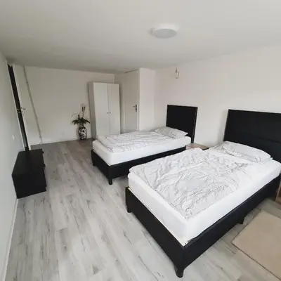 Ein Bett oder Betten in einem Zimmer der Unterkunft Boardinghouse Leiwen 46
