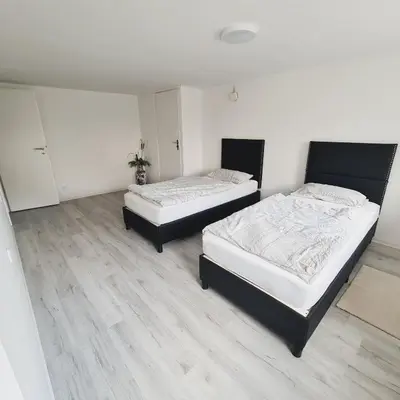 Ein Bett oder Betten in einem Zimmer der Unterkunft Boardinghouse Leiwen 46