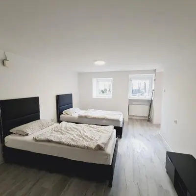 Ein Bett oder Betten in einem Zimmer der Unterkunft Boardinghouse Leiwen 46