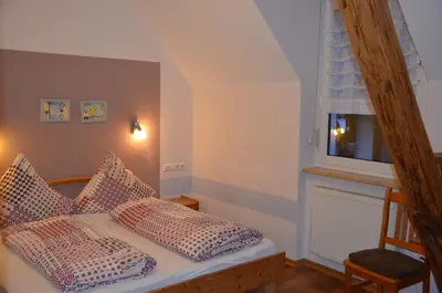 Ein Bett oder Betten in einem Zimmer der Unterkunft Ferienweingut Gansen Hochgenuss 2