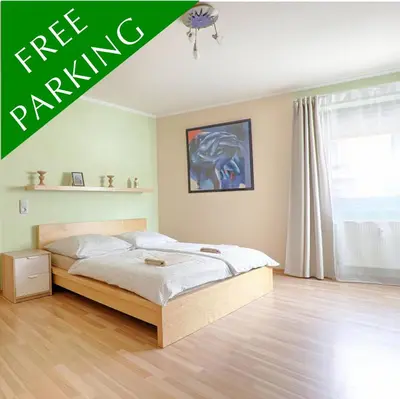 Ein Bett oder Betten in einem Zimmer der Unterkunft H-Apartments