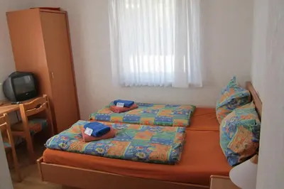Ein Bett oder Betten in einem Zimmer der Unterkunft Gästehaus Ströter